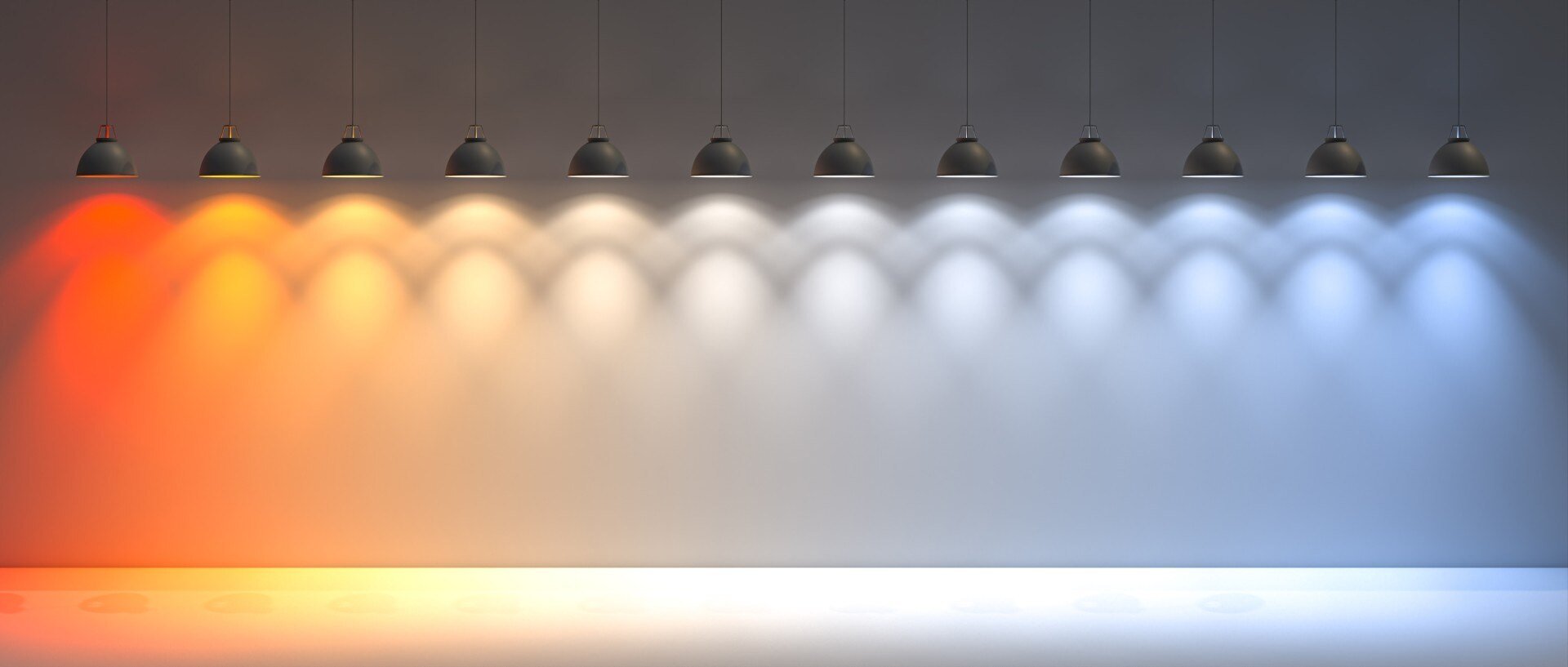 Range of lamps in a harmonious color gradient from warm orange to cool blue - stylish lighting for a modern exhibition stand that combines atmosphere and innovation